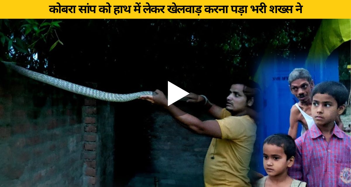 The man was doing stunts with a snake in his hand